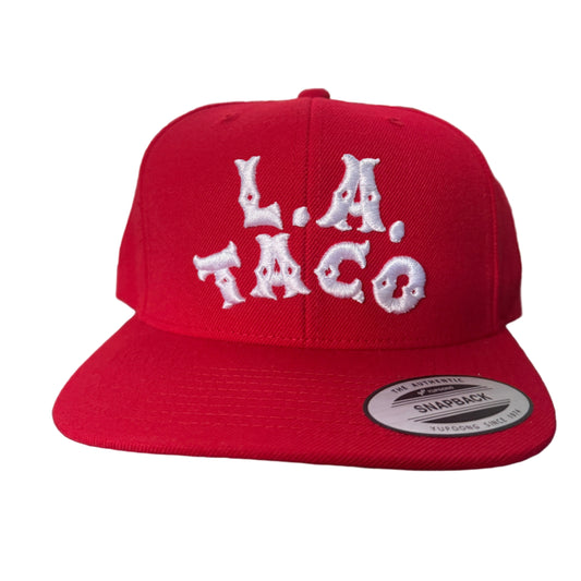 Red cap with white text that says L.A. TACO